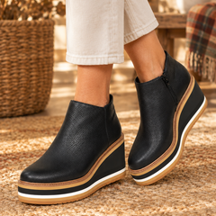 Liva orthopedic ankle boots in black worn by model