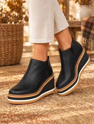 Liva orthopedic ankle boots in black worn by model