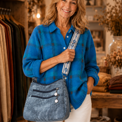 Colbie crossbody bag in blue worn by model
